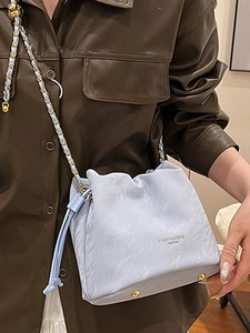 Fashionable light blue cloud-shaped crossbody bucket bag with elegant metal chain strap