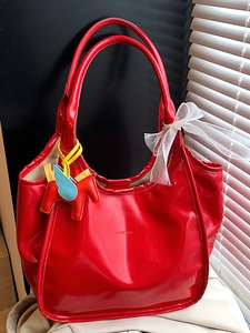 Glossy red oil wax leather tote bag with pegasus charm and ribbon for 2025 summer style