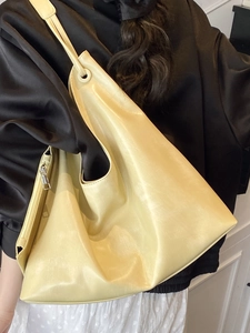 Minimalist cream-colored large capacity tote bag with long shoulder straps for women