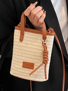 Mini contrast stripe woven crossbody bag with brown leather trim and shoulder strap