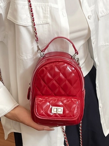 Fashionable red quilted mini backpack with chain strap and shiny patent leather finish