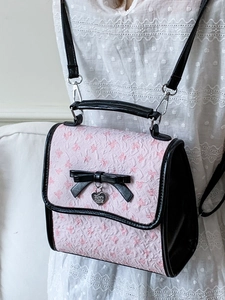 Rosa und schwarze Jacquard-Handtasche mit 3D-Schleife und silbernem Herzanhänger