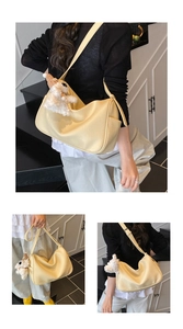 Cream yellow shoulder bag in lychee pattern leather with cute plush toy pendant detail