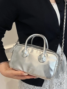 Modern metallic silver handbag with round handles and chain strap for women