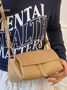 Chic camel woven texture crossbody bag with flap closure and adjustable leather strap