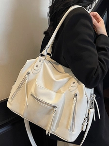 Chic off-white large capacity hobo bag with vintage texture and stylish tassel details
