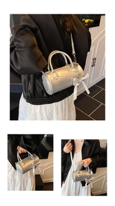 Detailed close-up of a silver cylinder bag with a white ribbon bow and sleek metallic finish