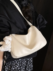Chic beige lychee grain hobo shoulder bag with a cute white plush sheep pendant charm