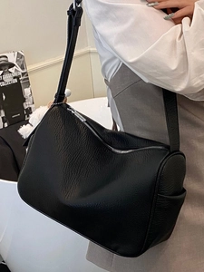Minimalist black lychee pattern leather crescent shoulder bag with silver hardware zipper