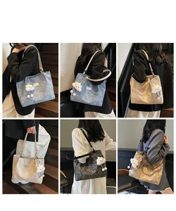 Detail of minimalist tote bags in blue, beige, and black with plush cloud charms