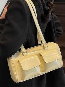 Retro pale yellow patent leather shoulder bag with dual pockets and glossy finish