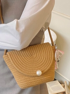 Straw woven crossbody bag with pearl buckle decoration and bow charm for summer fashion