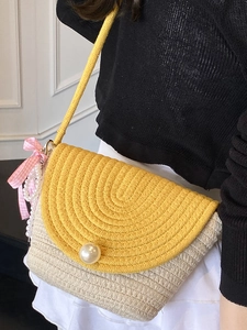 Summer woven straw crossbody bag in yellow and white with large pearl buckle and pink bow
