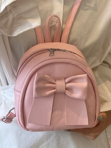 Pink mini faux leather backpack with large bow decoration for fashionable women