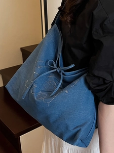Blue denim tote bag with rhinestone butterfly design and large capacity for college