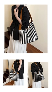 Detailed macro view showing striped canvas fabric and brown leather shoulder straps