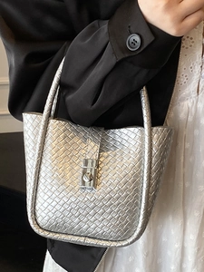Silver woven bucket bag with metallic finish and buckle, stylish hobo stylish hand-woven handbag