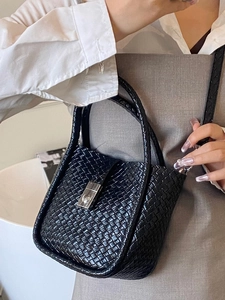 Women's black woven bucket bag with leather texture and silver buckle for summer fashion