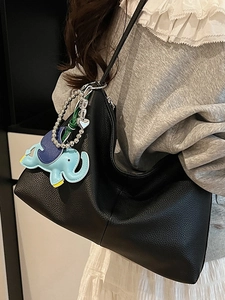 Minimalist black lychee texture underarm tote bag with cute elephant pendant for women