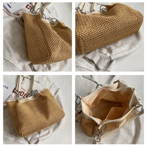 Detail view of woven straw tote bag with faux leather handles and inner pockets