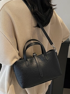 Chic black crocodile texture tote bag with silver hardware for hand or shoulder carry