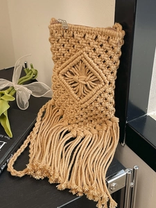 Handmade beige woven cotton rope shoulder bag with geometric patterns and fringe