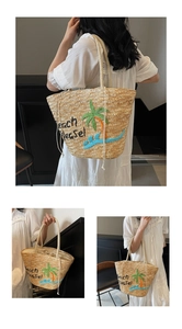 Detail of embroidered straw tote with Beach Please text and tropical palm tree pattern