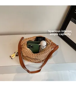Close-up of beige woven bucket bag interior showing large capacity and soft fabric lining