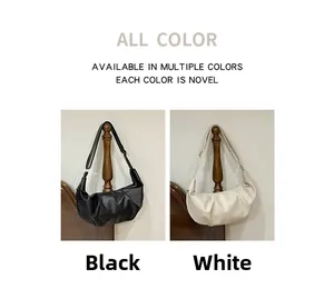 Detail of black and white dumpling hobo bags with lychee pattern leather and pleated design