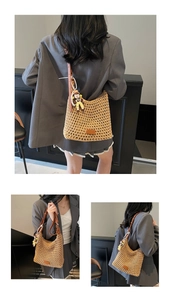 Detail view of woven cotton bucket bag featuring premium leather straps and a cute charm