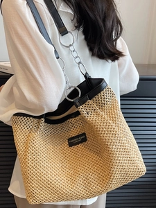 Summer woven straw tote bag with black leather straps and silver metal chain links