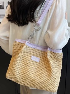 Large straw tote bag in light beige with lilac leather trim and silver chain strap