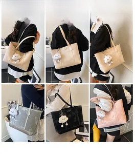 Model display of chic underarm tote bags in beige, silver, black and pink with cloud charms