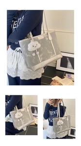 Close-up of silver tote bag with marble texture and cute cloud charm detail