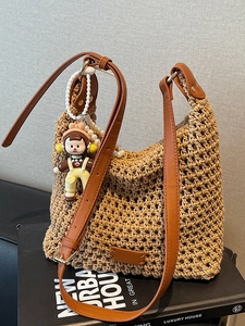 Handwoven large capacity cotton bucket bag with brown leather handles and a cute charm