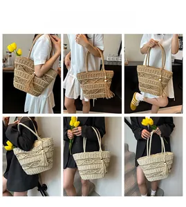 Detail of hand-woven straw tote bag with hollow patterns and stylish long tassels
