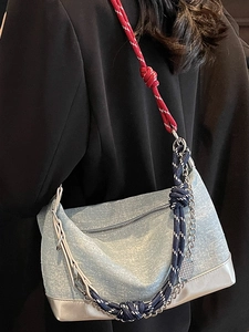 Denim shoulder bag with blue climbing rope strap and silver metallic trim detailing