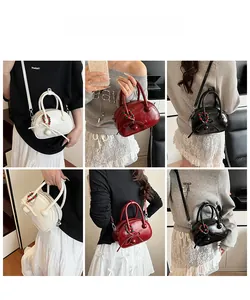 Detail shots of bowling bag in white, red and black with bow and beaded charms
