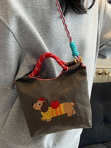 Brown bucket bag with cute dachshund embroidery and multicolor braided shoulder strap