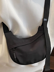 Minimalist black crescent crossbody bag with adjustable strap for daily casual wear