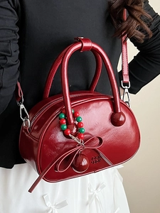 Burgundy patent leather bowling bag with bow pendant and bead chain strap for women
