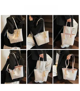 Multiple views of a white patterned tote bag with pink trim on a model at a staircase