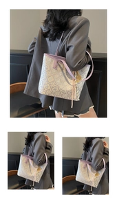 Detail of lavender geometric jacquard tote bag with purple leather trim and tennis charm