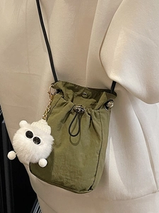 Fashionable army green nylon crossbody bucket bag with cute plush monster charm