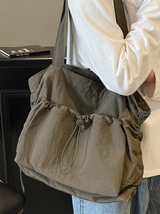 Olive green large capacity tote bag with drawstring pocket and nylon fabric