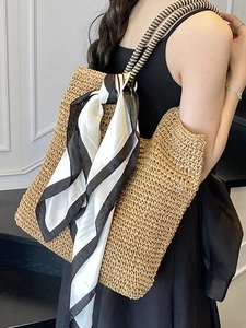 Large capacity woven straw tote bag with black and white striped scarf for summer commuting