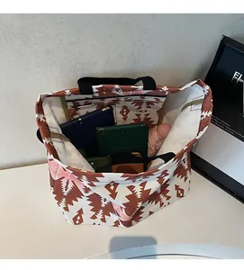 Interior view of large capacity canvas tote bag with geometric print and inner pocket