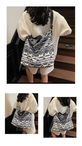 Detail of large canvas tote bag with gray ethnic geometric pattern and wide shoulder strap