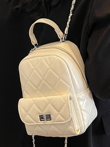 Quilted mini backpack in cream faux leather with chain straps and metal twist lock