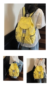Detailed views of bright yellow nylon drawstring backpack with square logo patch